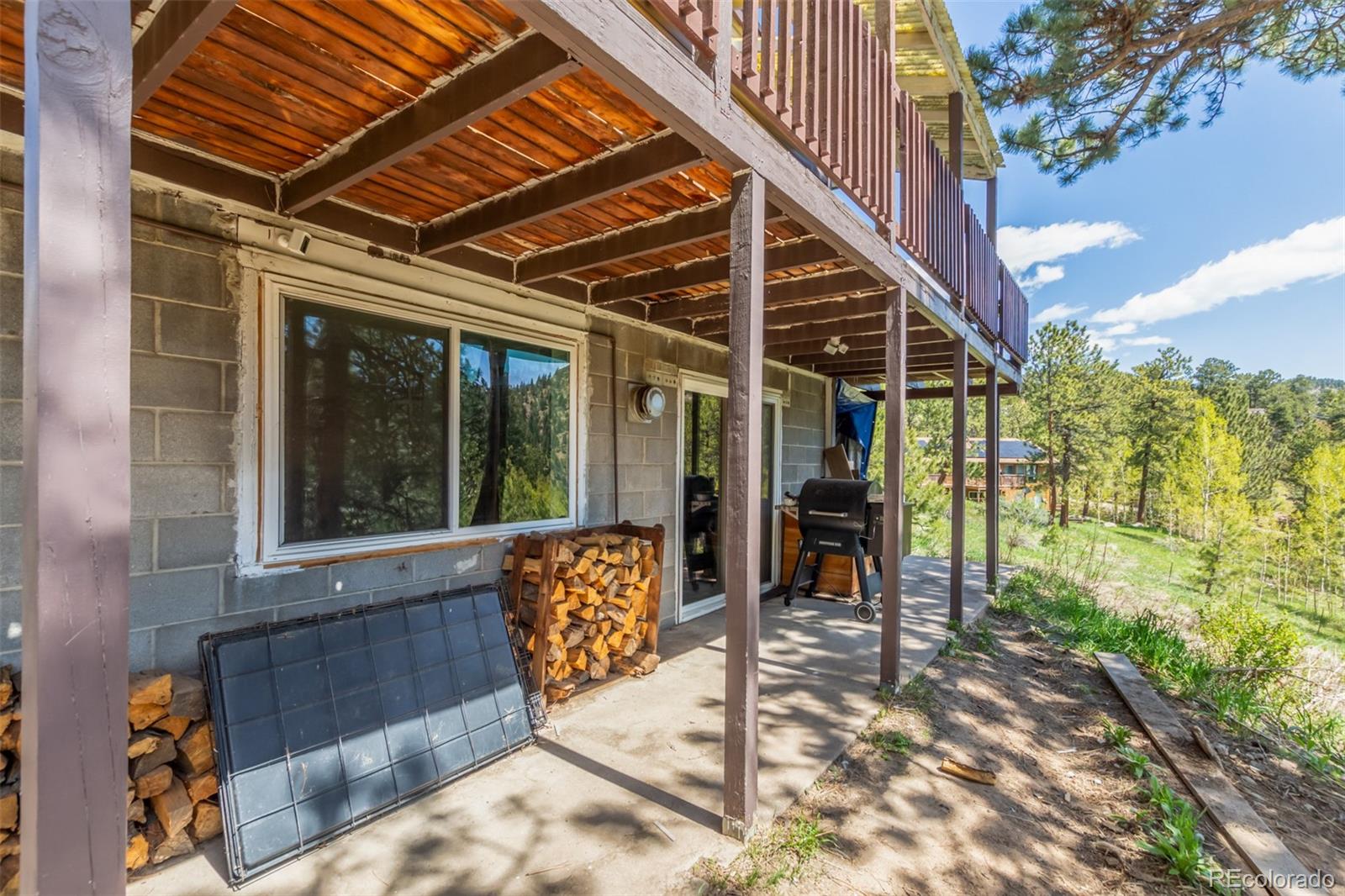 11388 Ranch Elsie Road Golden, CO 80403 - Photo 44 of 50 a view of a porch with furniture