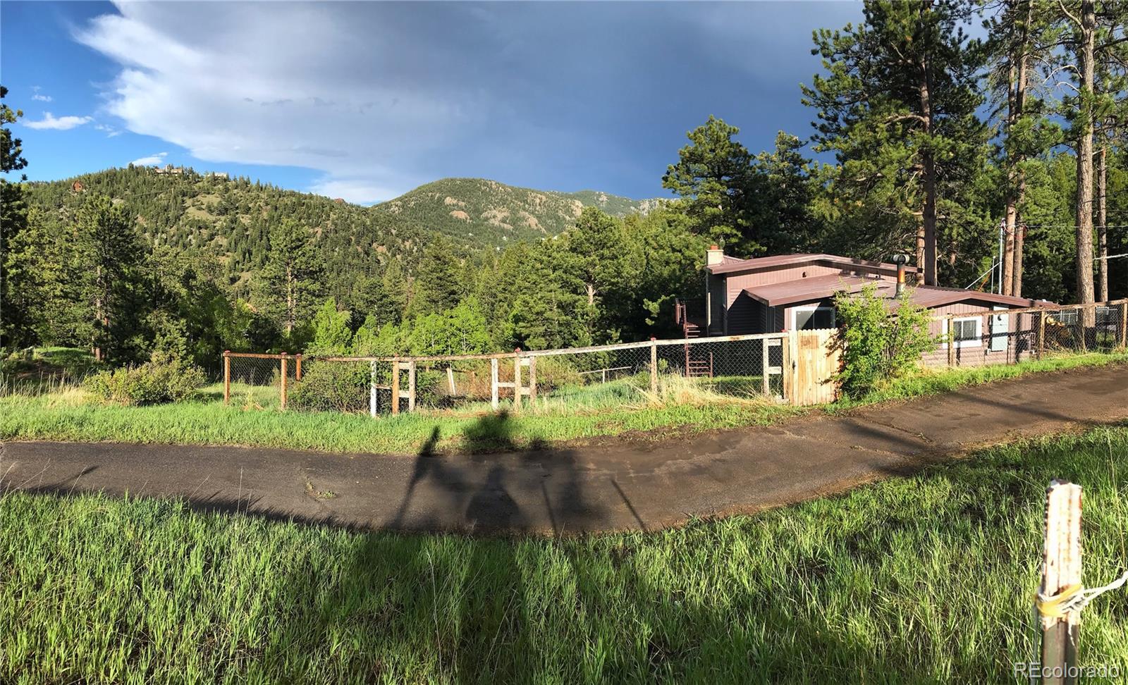 11388 Ranch Elsie Road Golden, CO 80403 - Photo 50 of 50 a view of a house with a yard