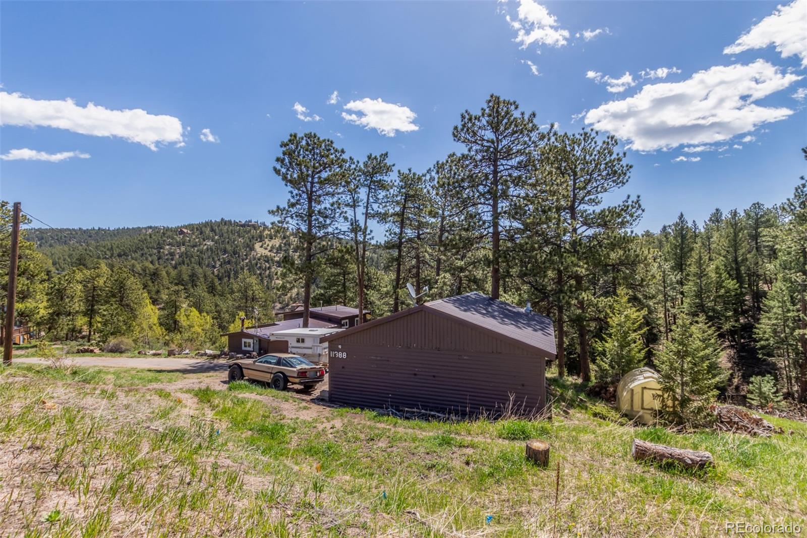 11388 Ranch Elsie Road Golden, CO 80403 - Photo 5 of 50 a aerial view of a house with yard and entertaining space