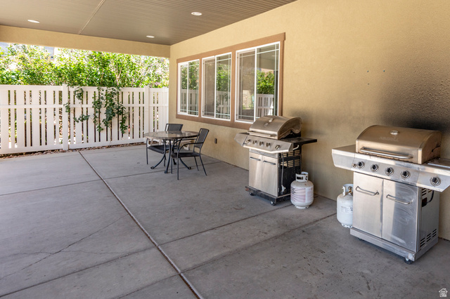1177 Northfield Road, Unit 26 Cedar City, UT 84721 - Photo 45 of 45 Covered patio featuring a concrete slab, recessed lighting, and a white picket fence perimeter