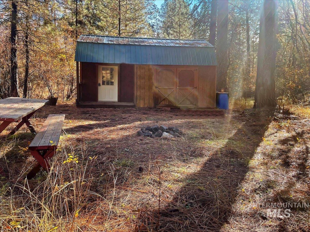 Lot 28 Horseshoe Rd Garden Valley Garden Valley, ID 83622 - Photo 6 of 28 View of outbuilding with a wooded view