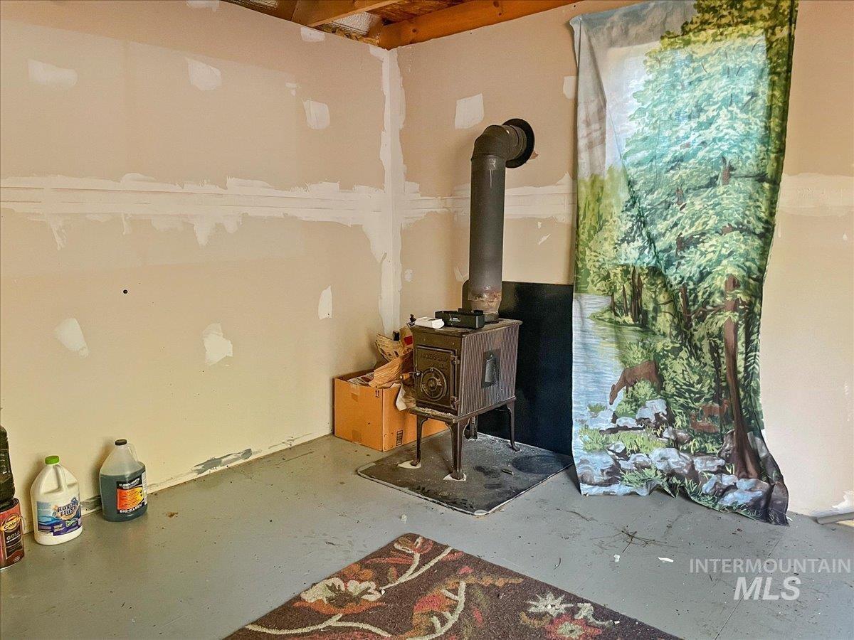 Lot 28 Horseshoe Rd Garden Valley Garden Valley, ID 83622 - Photo 9 of 28 Below grade area with a wood stove