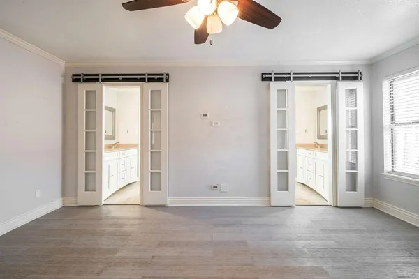 a view of an empty room with a window