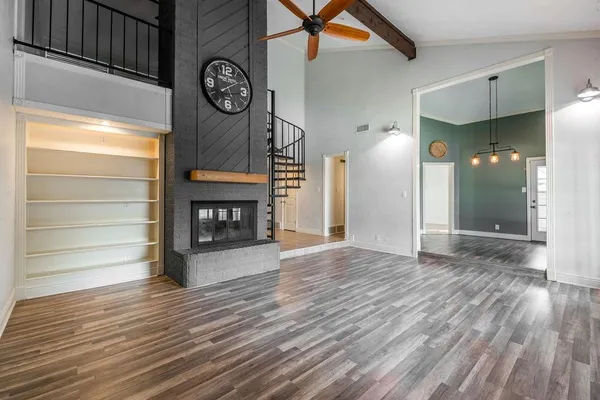 a view of an entryway with wooden floor