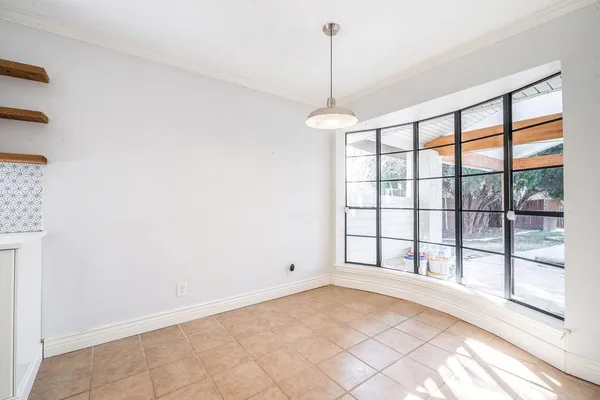 a view of an empty room and window