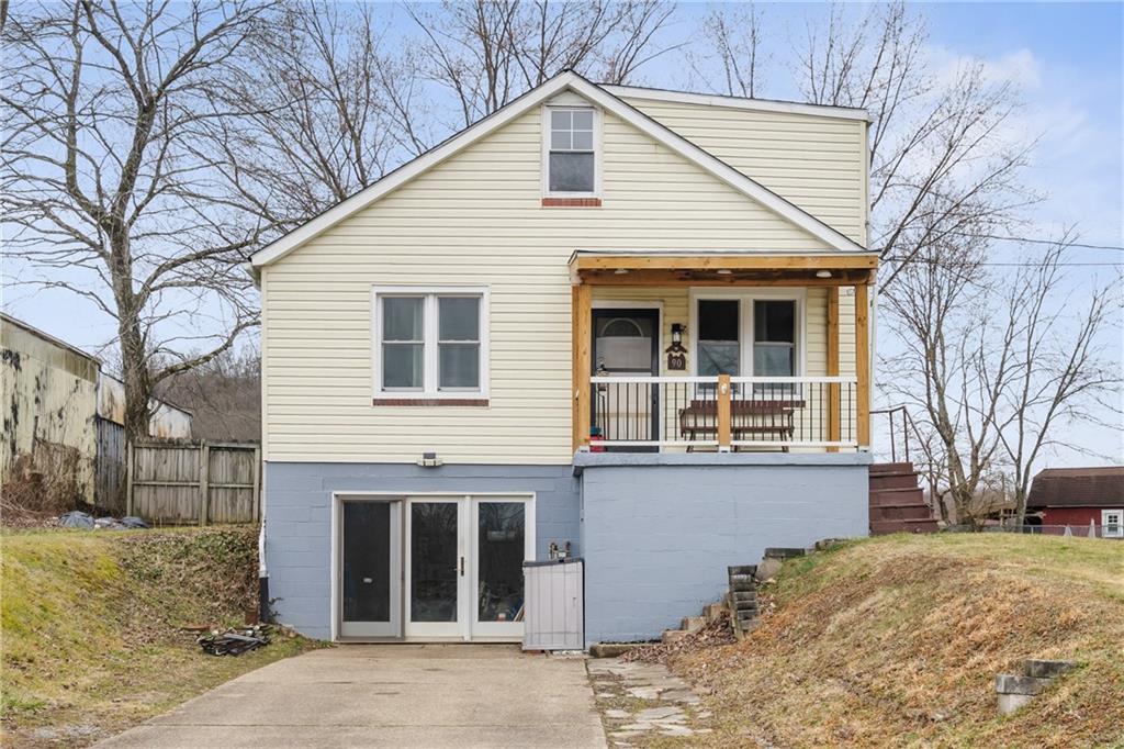 90 Dellenbaugh Road Tarentum, PA 15084 - Photo 1 of 25 a view of a house with a yard and large tree