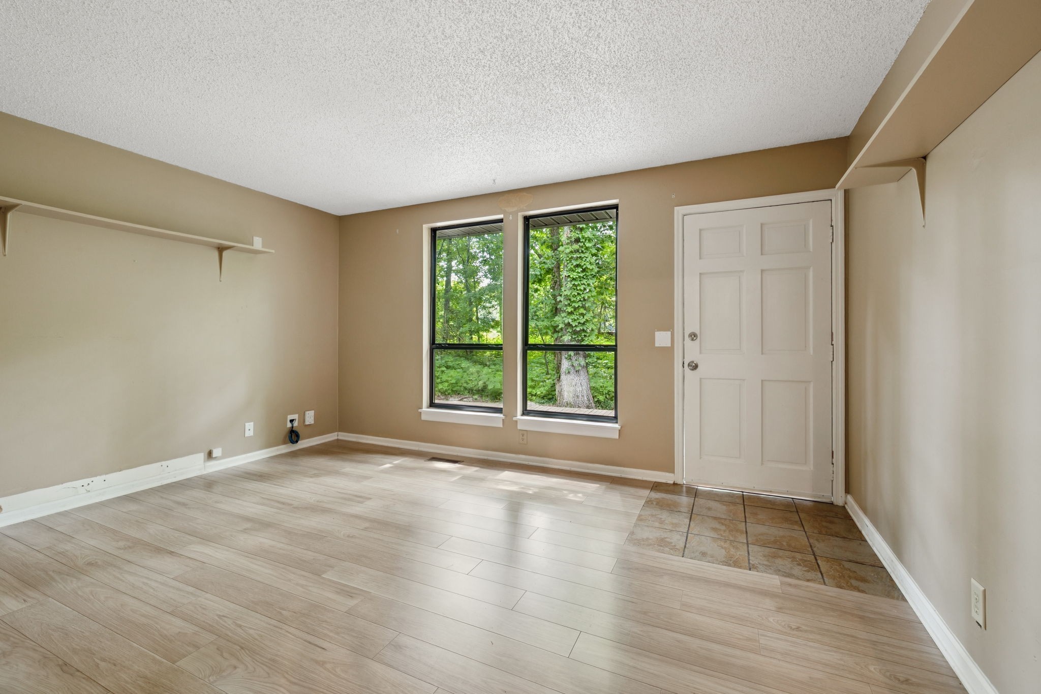 6031 Buckeye Valley Road Murfreesboro, TN 37129 - Photo 15 of 47 a view of an empty room with wooden floor and a window