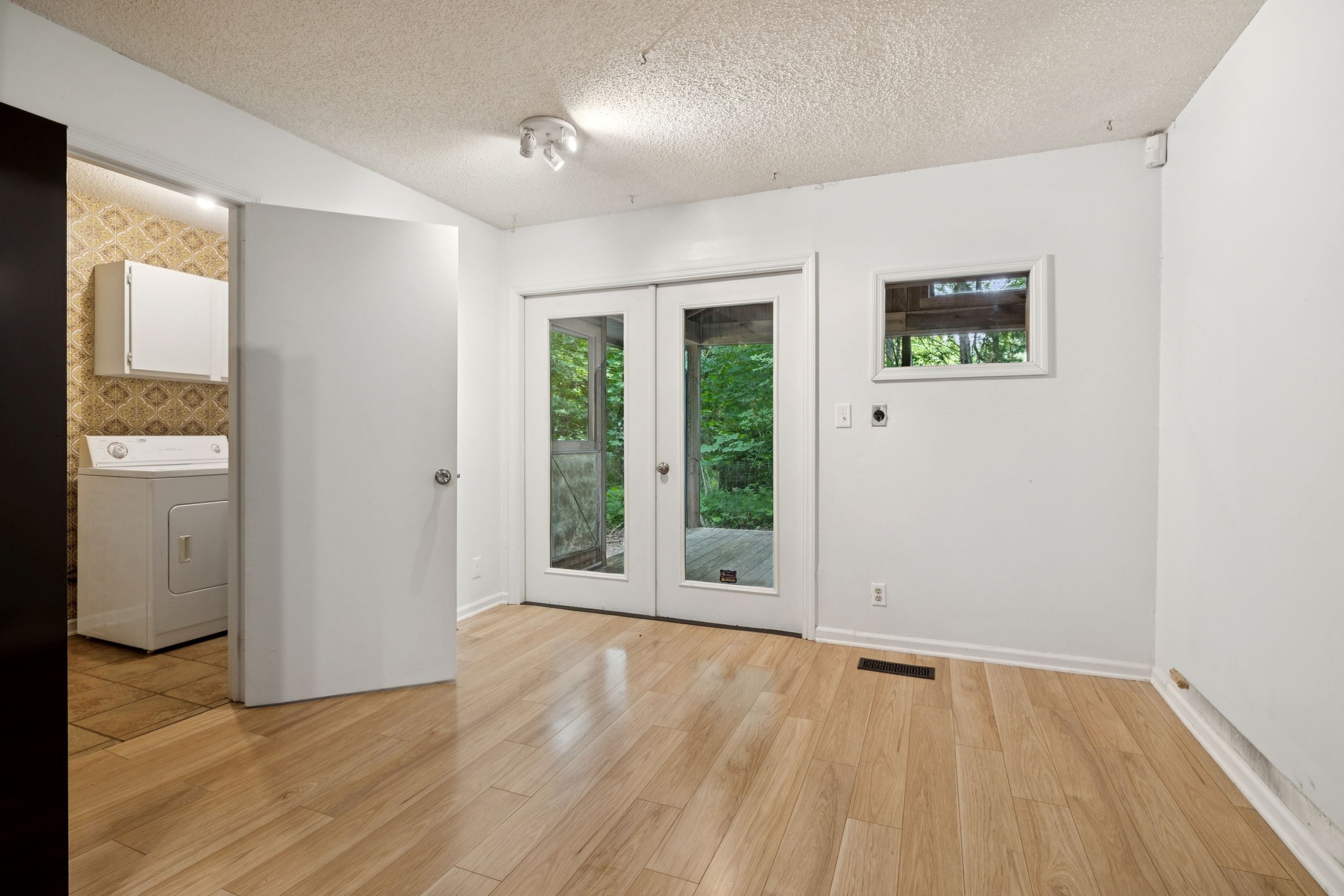 6031 Buckeye Valley Road Murfreesboro, TN 37129 - Photo 21 of 47 a view of an empty room with wooden floor and a window