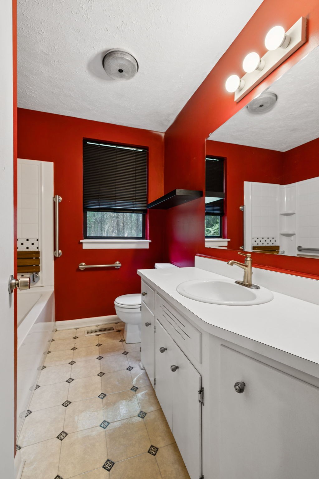 6031 Buckeye Valley Road Murfreesboro, TN 37129 - Photo 25 of 47 a bathroom with a sink a mirror and a bathtub