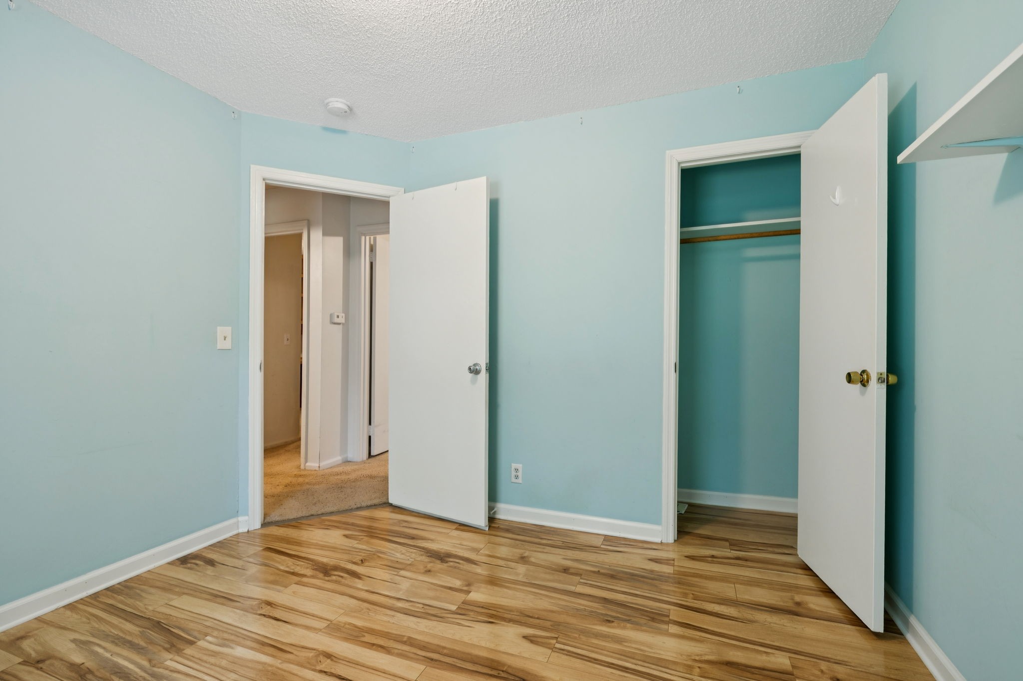 6031 Buckeye Valley Road Murfreesboro, TN 37129 - Photo 30 of 47 a view of an empty room with wooden floor and closet