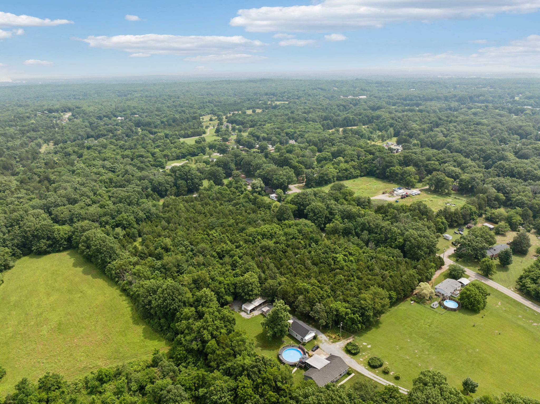 6031 Buckeye Valley Road Murfreesboro, TN 37129 - Photo 43 of 47 an aerial view of residential houses with outdoor space and trees