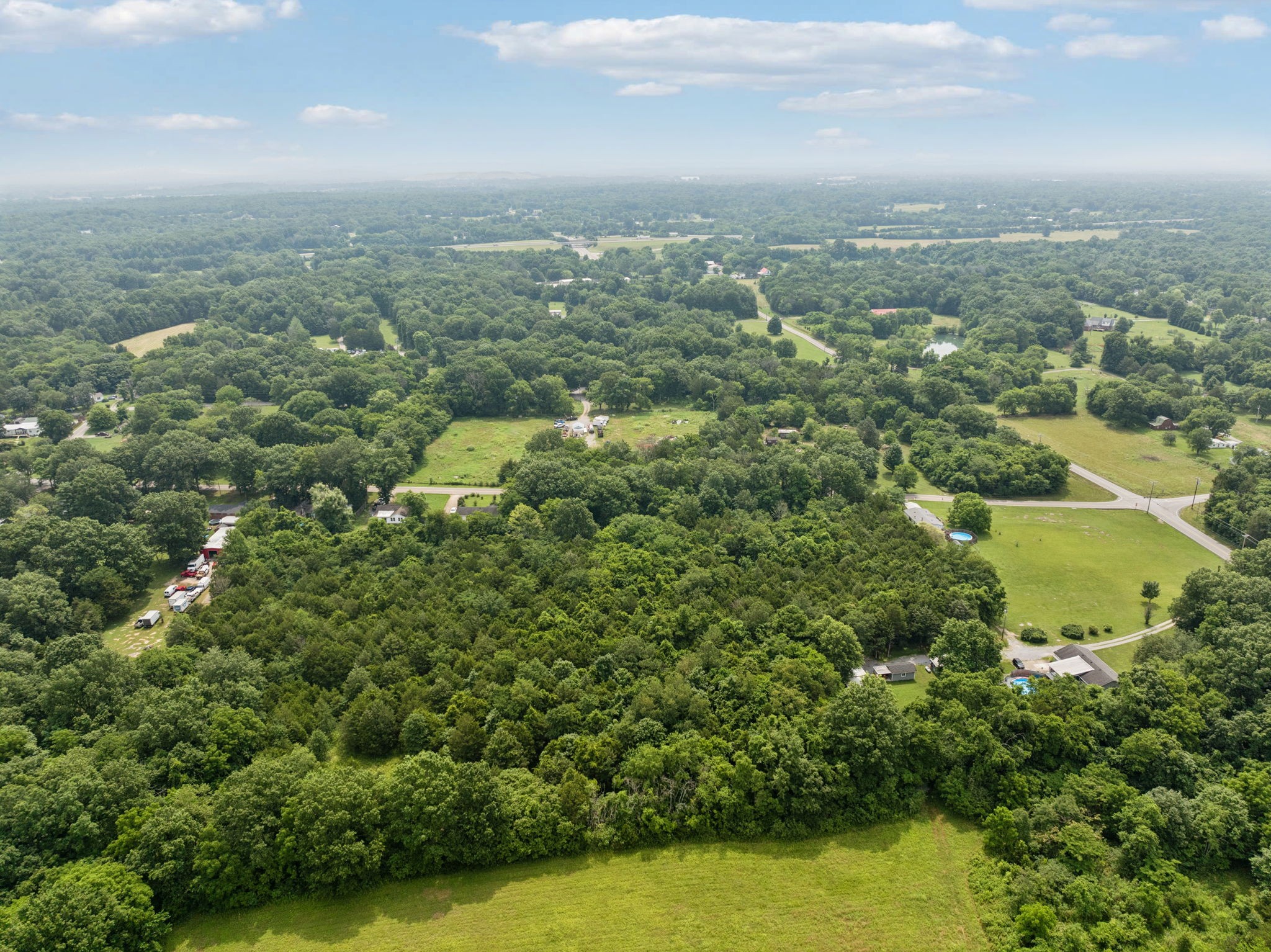 6031 Buckeye Valley Road Murfreesboro, TN 37129 - Photo 44 of 47 an aerial view of residential houses with outdoor space and trees