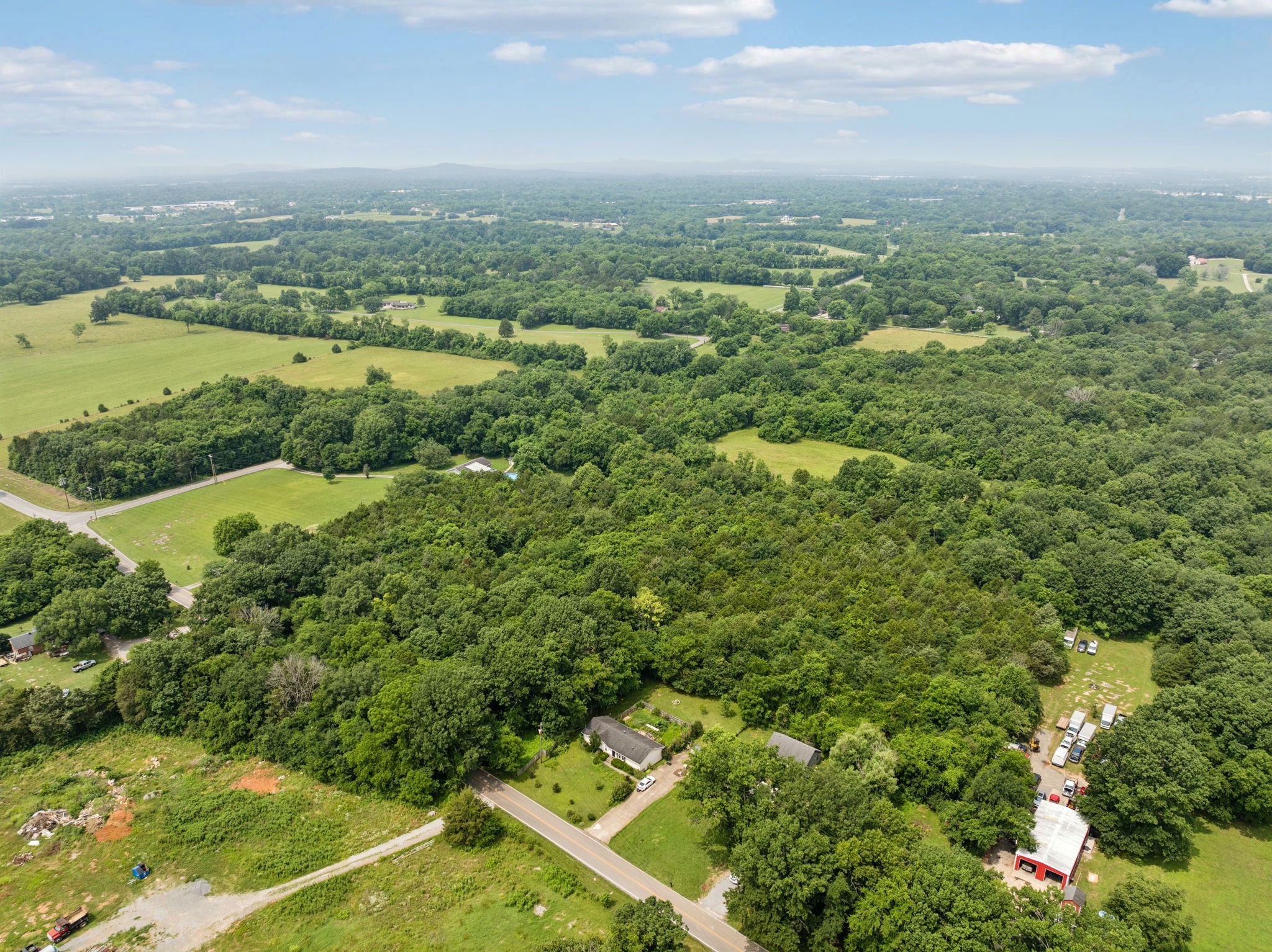 6031 Buckeye Valley Road Murfreesboro, TN 37129 - Photo 47 of 47 an aerial view of residential houses with outdoor space and trees