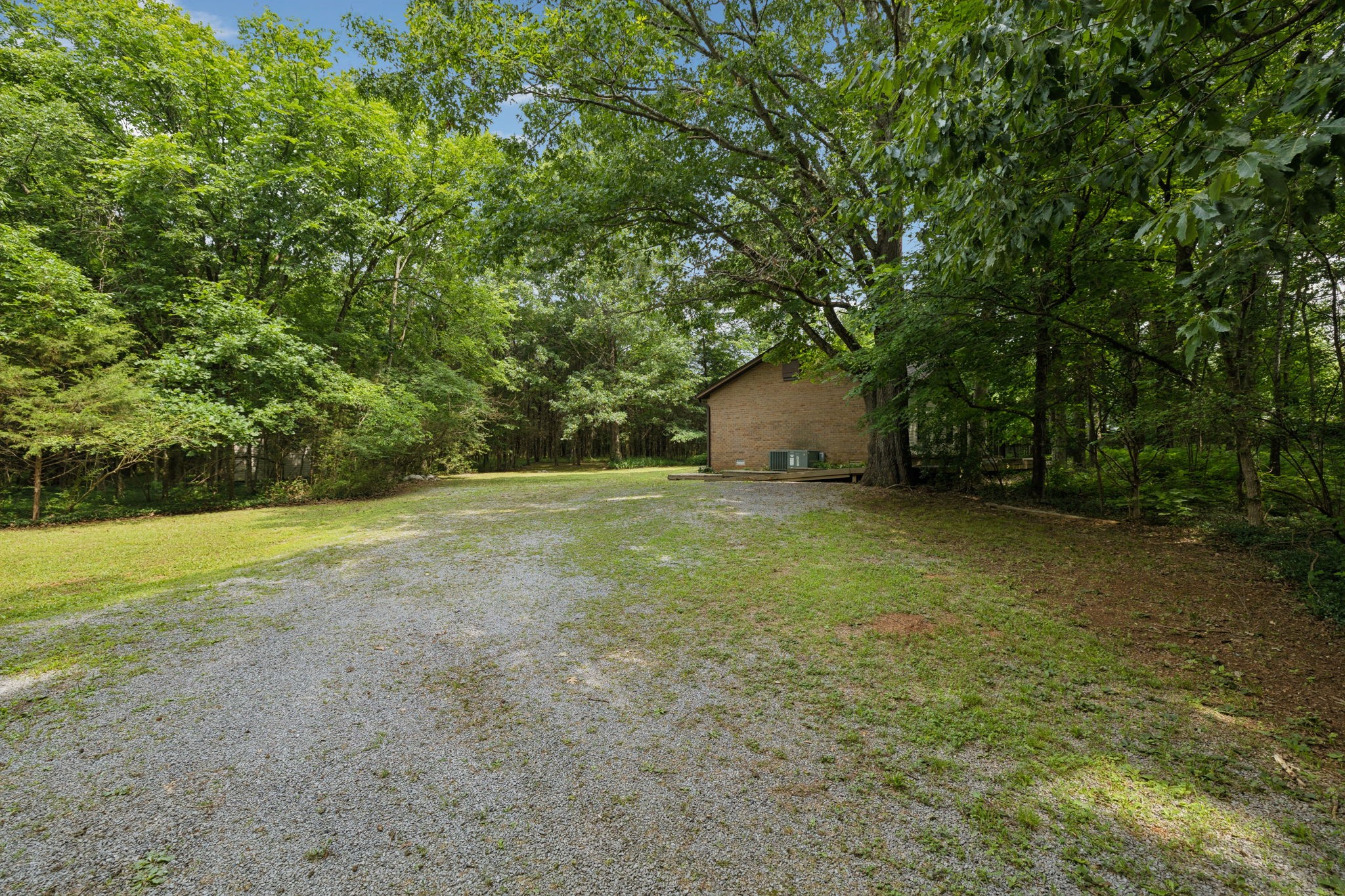 6031 Buckeye Valley Road Murfreesboro, TN 37129 - Photo 6 of 47 a view of a field with trees in front of it
