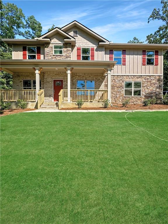 135 Lynn Top Ridge Dallas, GA 30157 - Photo 1 of 1 a view of a white house with a big yard and large trees
