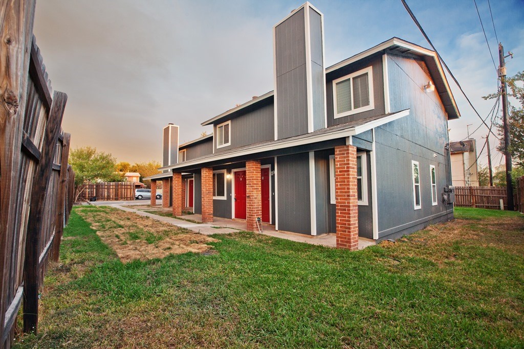 8401 Colony Loop Drive, Unit D Austin, TX 78724 - Photo 17 of 18 a view of a house with backyard and fence