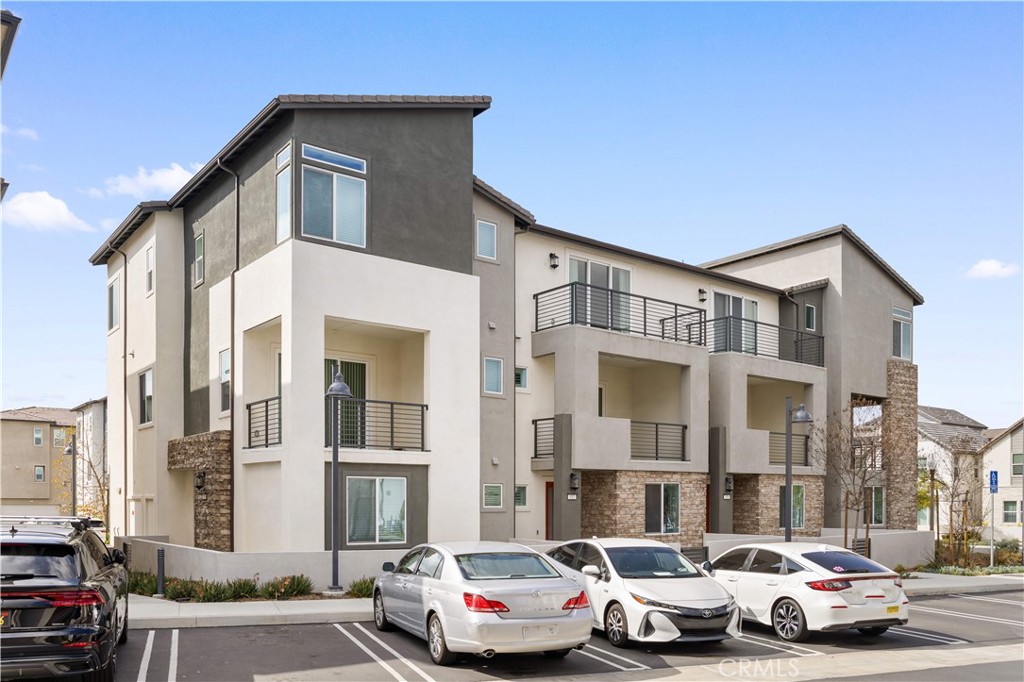 312 Tank Irvine, CA 92618 - Photo 1 of 75 a front view of a residential apartment building with a yard