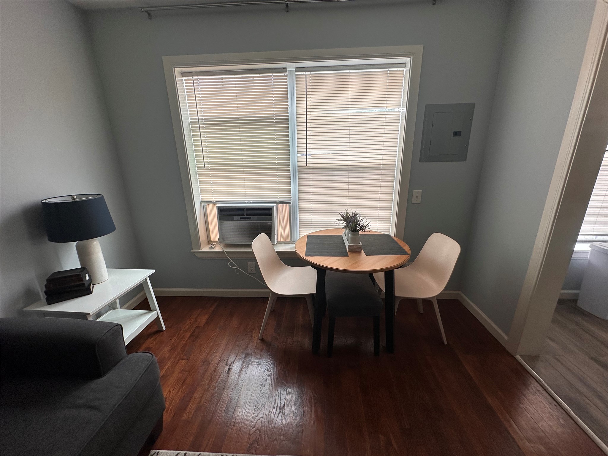 4302 Polk Street, Unit 8 Houston, TX 77023 - Photo 3 of 9 a view of a dining room with furniture window and wooden floor