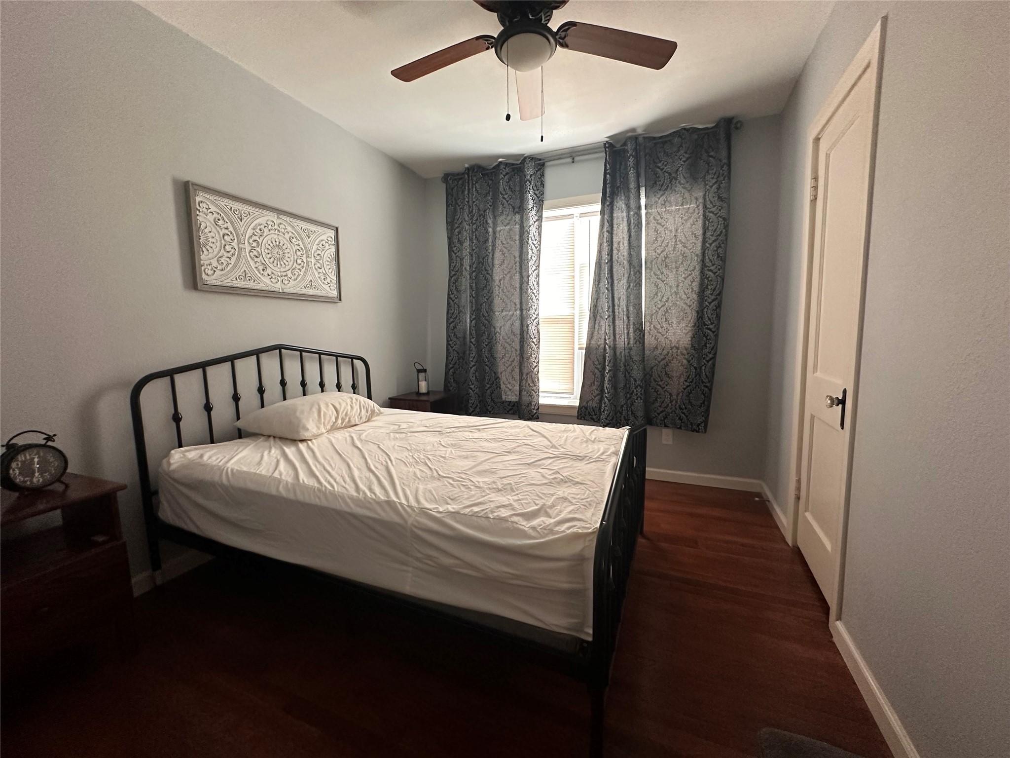 4302 Polk Street, Unit 8 Houston, TX 77023 - Photo 4 of 9 a bedroom with bed and window