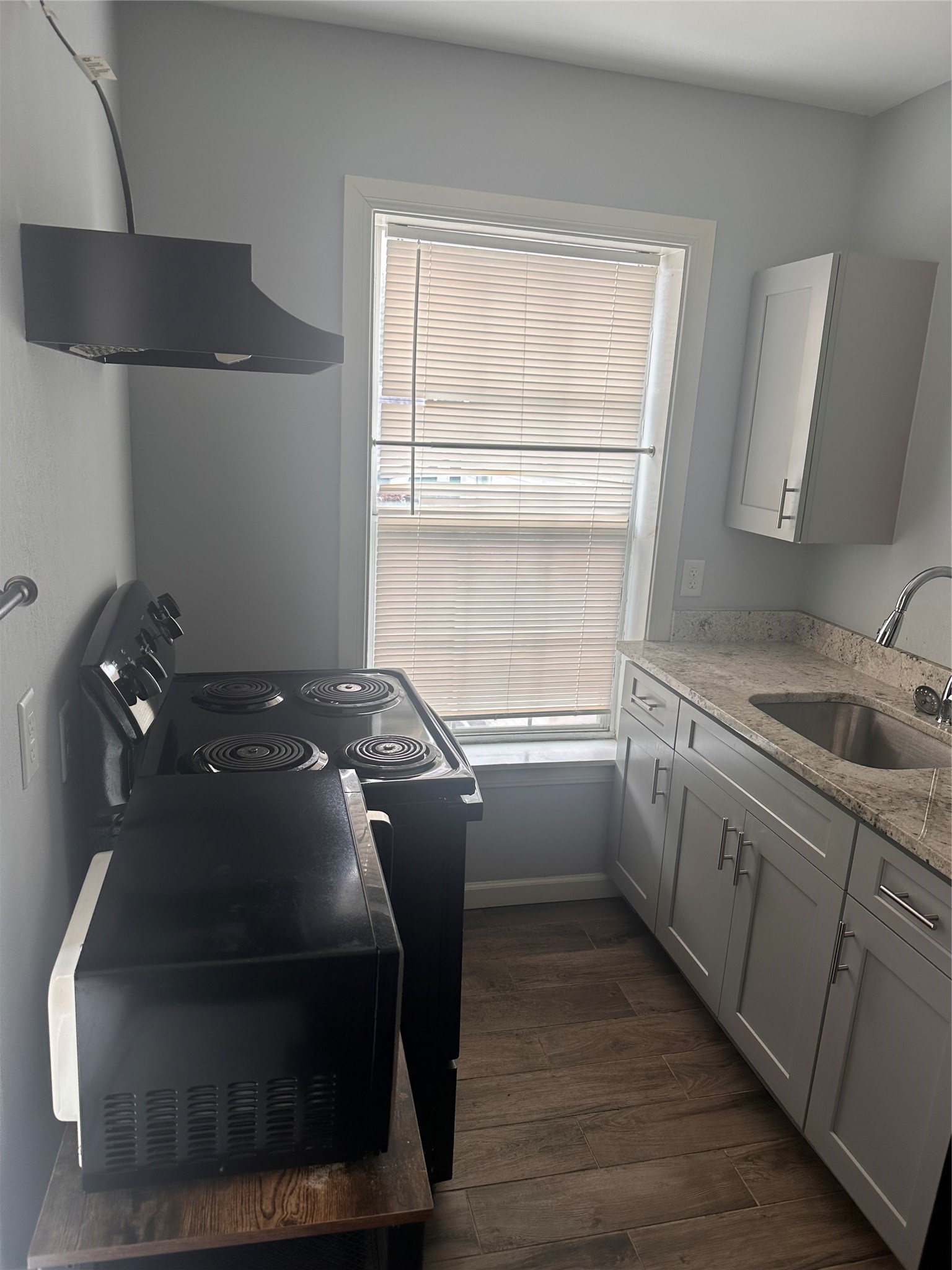 4302 Polk Street, Unit 8 Houston, TX 77023 - Photo 6 of 9 a kitchen with a sink and cabinets
