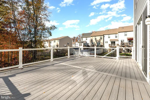 a view of a balcony with wooden floor