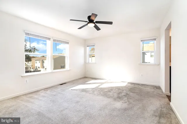a view of empty room with windows
