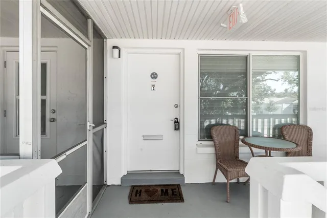 a view of a livingroom with furniture and front door