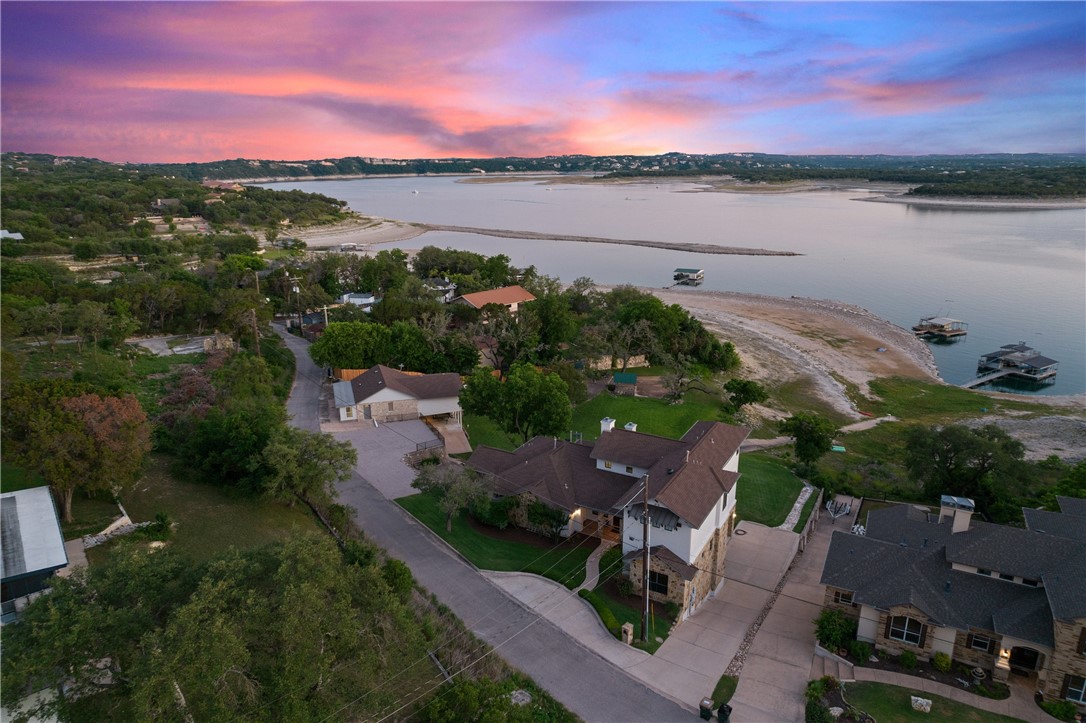 a view of a lake with houses in the back