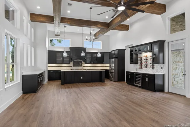 a large kitchen with stainless steel appliances kitchen island granite countertop a large counter top stainless steel appliances and cabinets