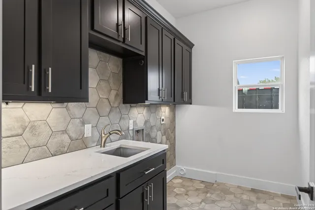 a bathroom with a sink and a mirror