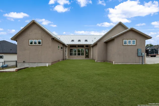 a view of an house with backyard space and garden