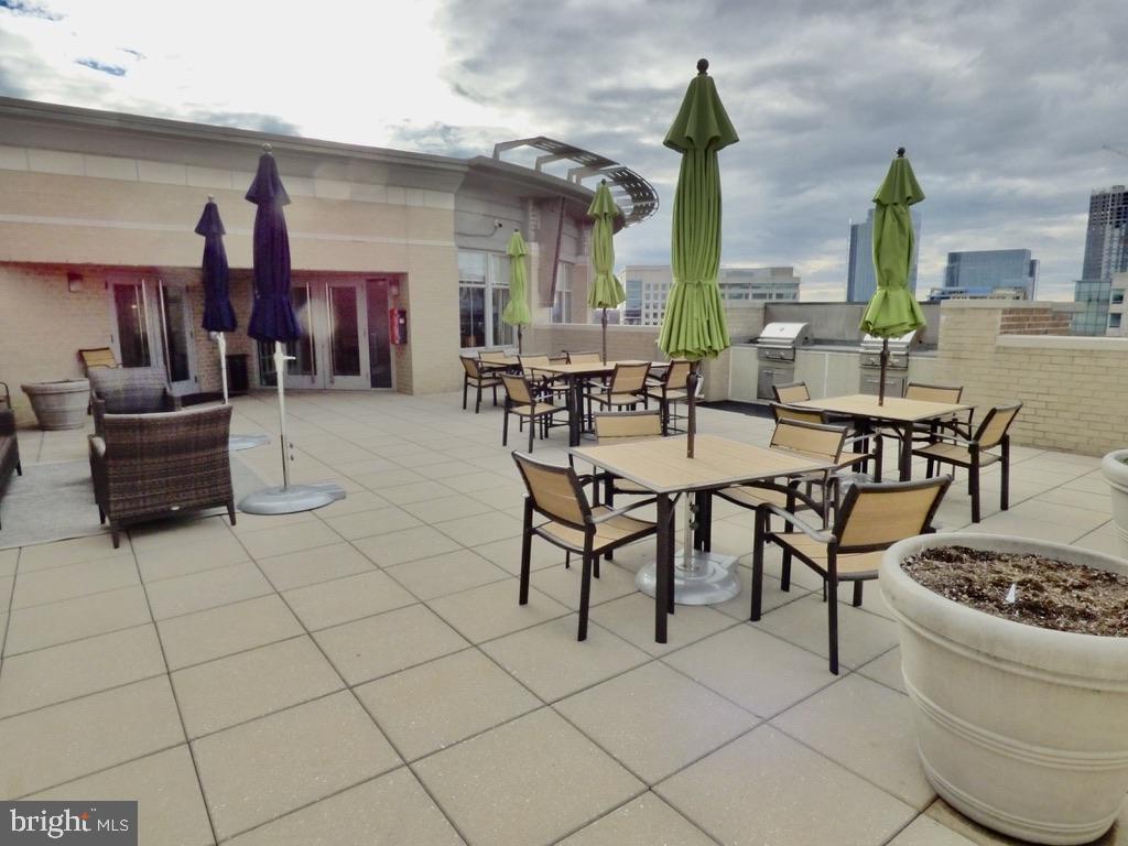 11800 Sunset Hills Road, Unit 118 Reston, VA 20190 - Photo 50 of 52 Rooftop oasis with vibrant umbrellas.