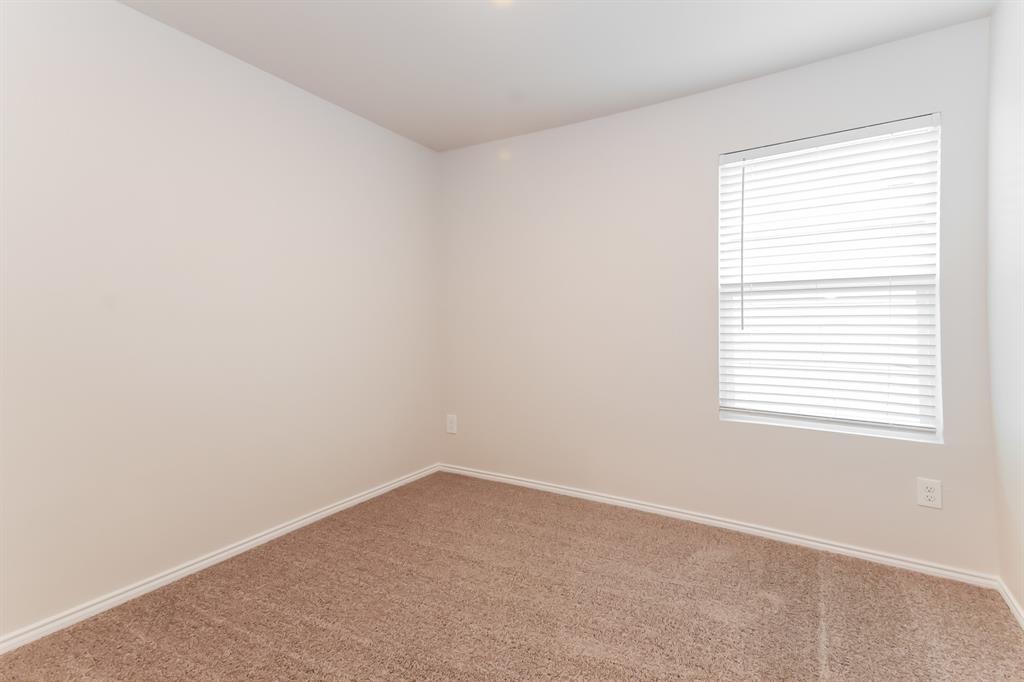 5213 Longshadow Drive Princeton, TX 75407 - Photo 11 of 16 an empty room with a window