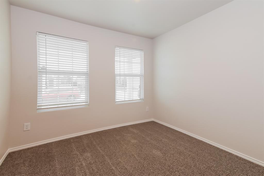 5213 Longshadow Drive Princeton, TX 75407 - Photo 12 of 16 an empty room with a window