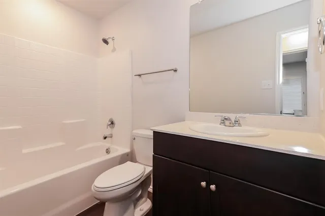 a bathroom with a sink a toilet and a bathtub