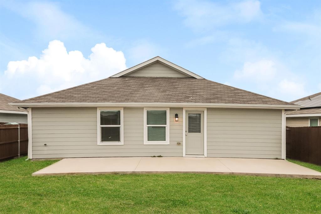 5213 Longshadow Drive Princeton, TX 75407 - Photo 15 of 16 a front view of a house with a yard and garage