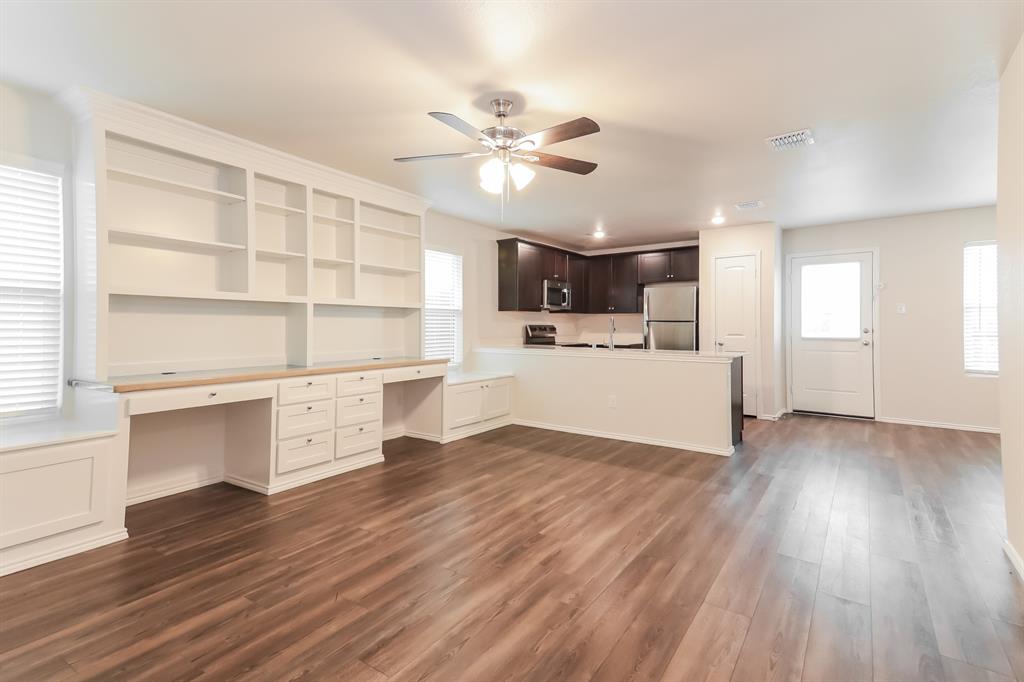 5213 Longshadow Drive Princeton, TX 75407 - Photo 6 of 16 a view of a kitchen with microwave and cabinets