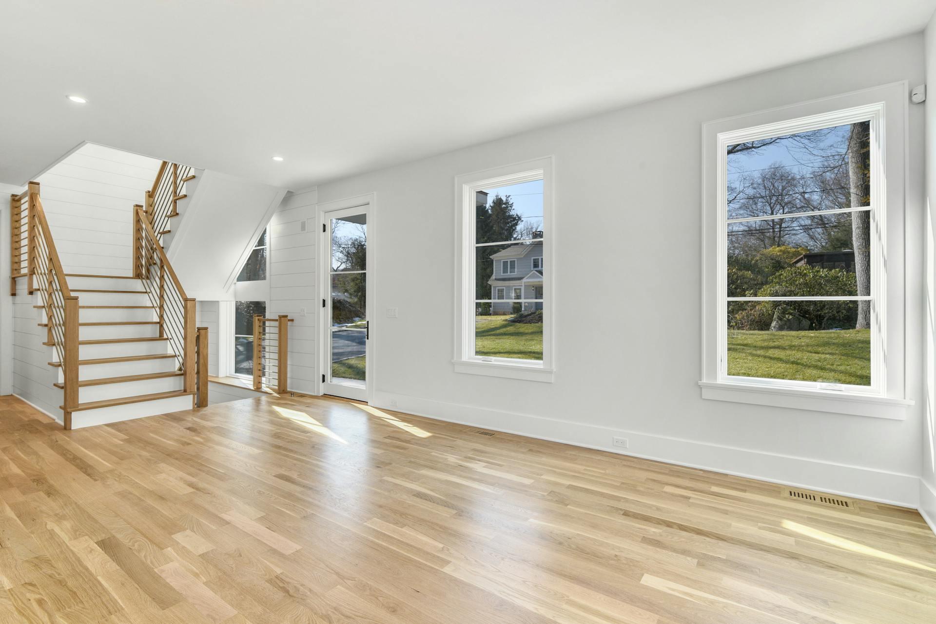 10 Range Road Rowayton, CT 06853 - Photo 6 of 40 a view of an empty room with a window and wooden floor