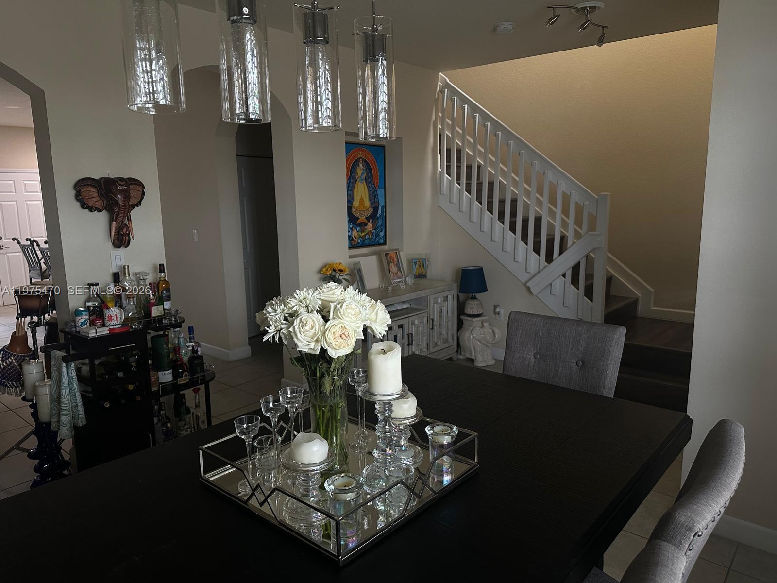 17135 Southwest 96th Street Miami, FL 33196 - Photo 12 of 36 a dining room with furniture and wooden floor