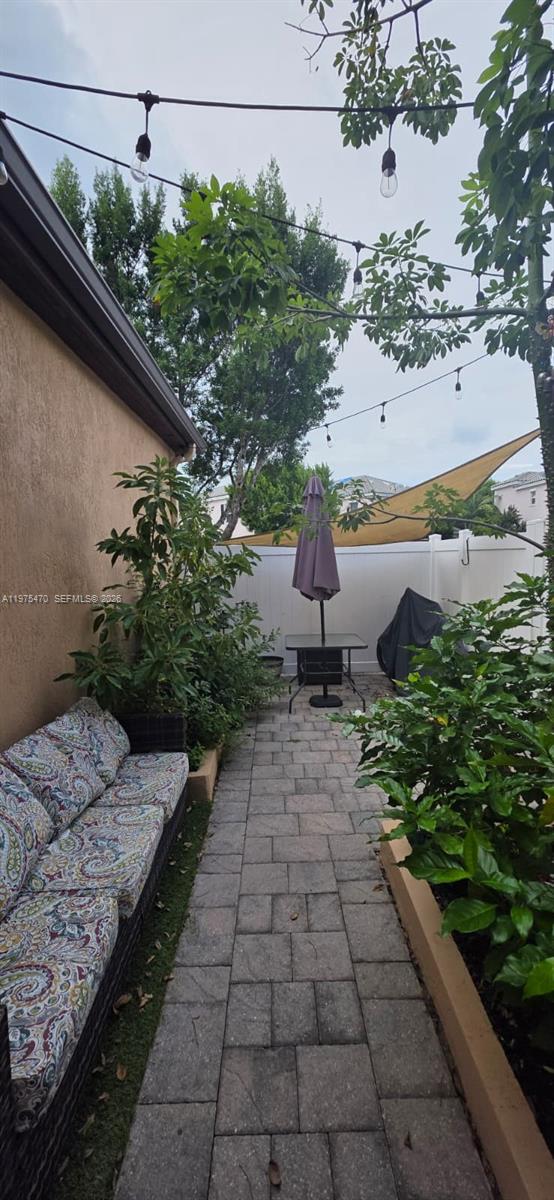 17135 Southwest 96th Street Miami, FL 33196 - Photo 13 of 36 a view of a backyard with pathway
