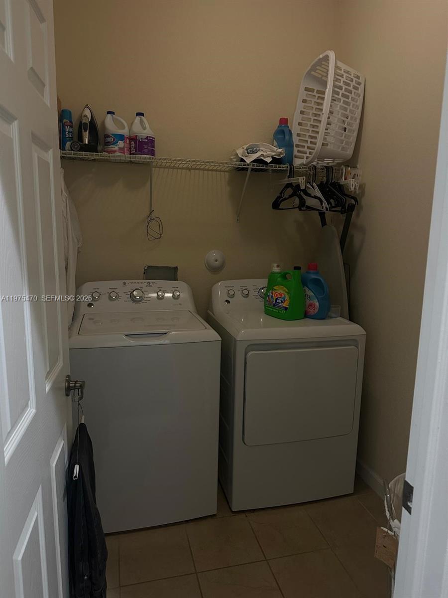 17135 Southwest 96th Street Miami, FL 33196 - Photo 18 of 36 a utility room with dryer and washer
