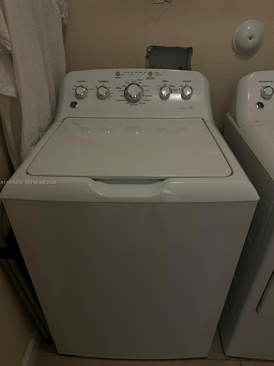 17135 Southwest 96th Street Miami, FL 33196 - Photo 20 of 36 a utility room with dryer and washer
