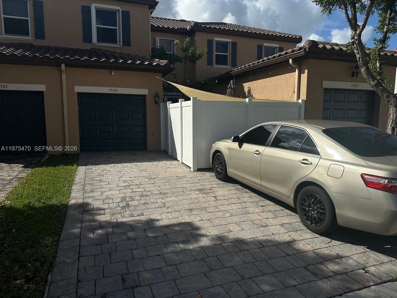 17135 Southwest 96th Street Miami, FL 33196 - Photo 2 of 36 a view of a car parking space