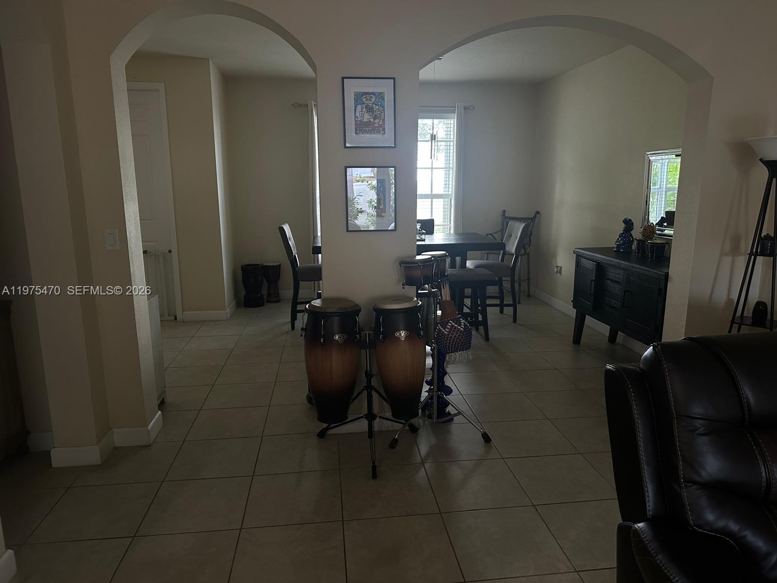 17135 Southwest 96th Street Miami, FL 33196 - Photo 24 of 36 a dining room with furniture and window