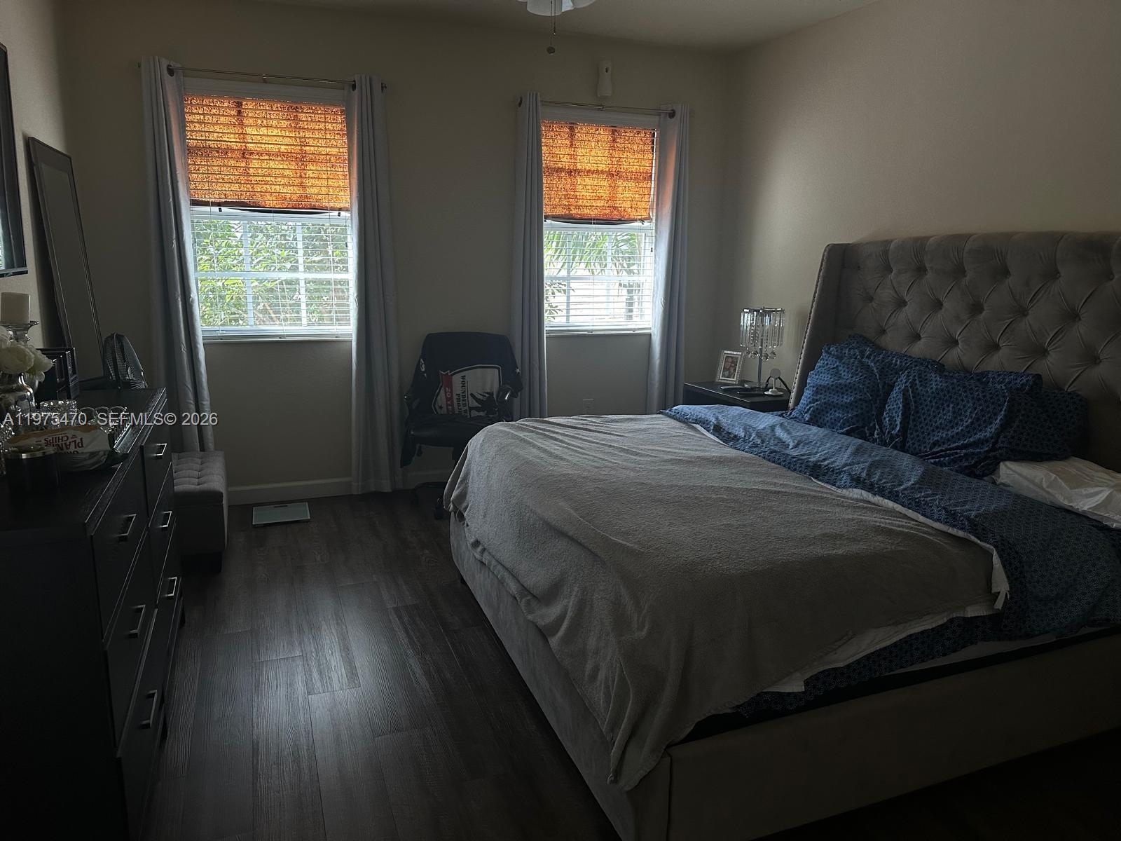 17135 Southwest 96th Street Miami, FL 33196 - Photo 28 of 36 a bedroom with a bed and a window
