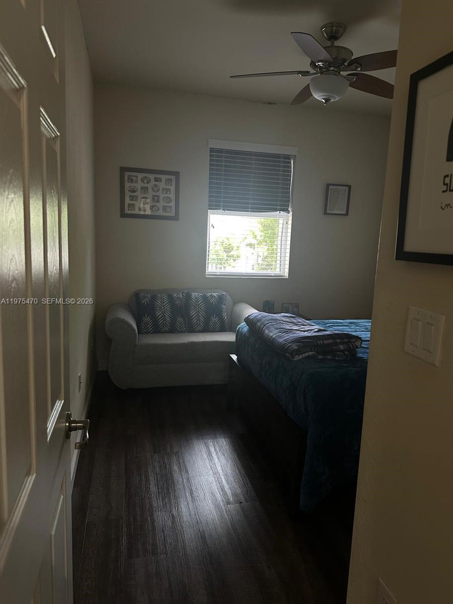 17135 Southwest 96th Street Miami, FL 33196 - Photo 5 of 36 a living room with furniture and a window
