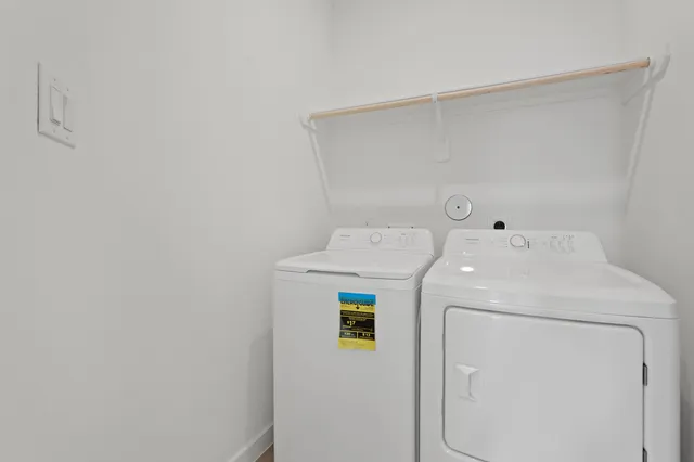 a view of a house with a yard and porch