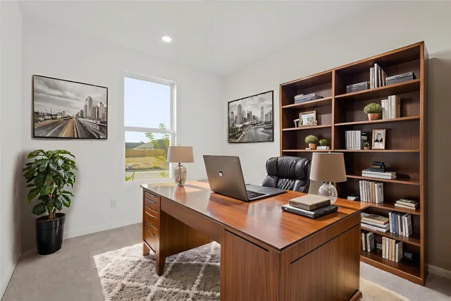 a view of a workspace with furniture