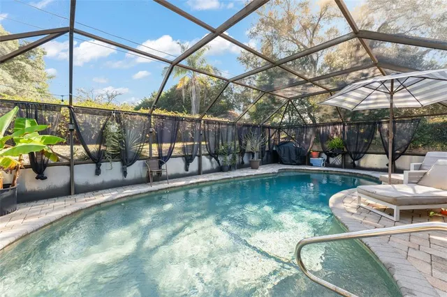 a view of a swimming pool with a patio