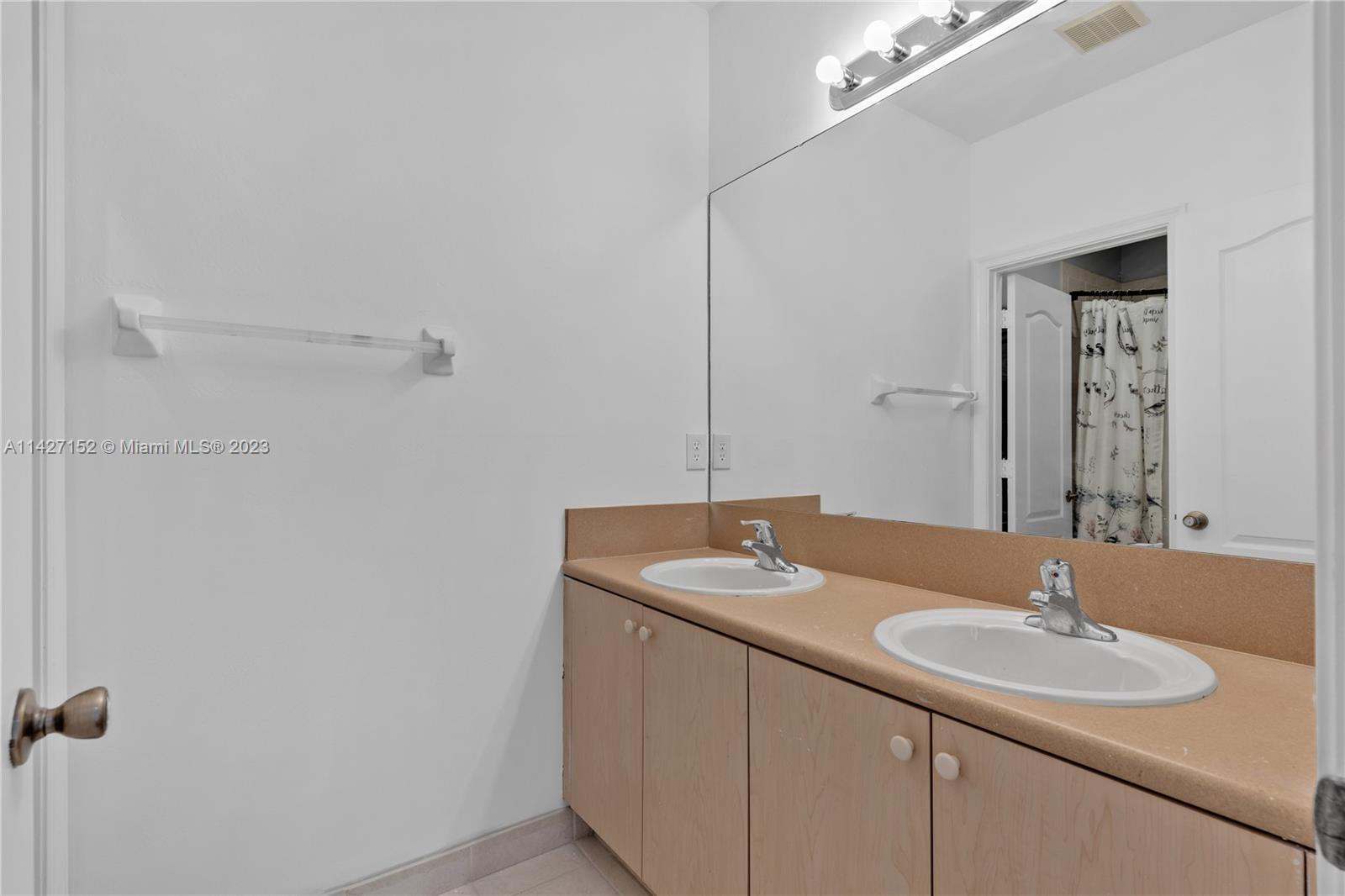 3759 Northeast 15th Street Homestead, FL 33033 - Photo 18 of 55 a bathroom with a sink and a mirror